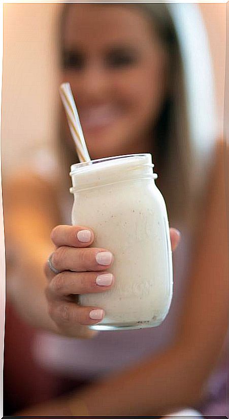 Girl with smoothie in hand